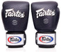 Pair of black Fairtex boxing gloves on a white background