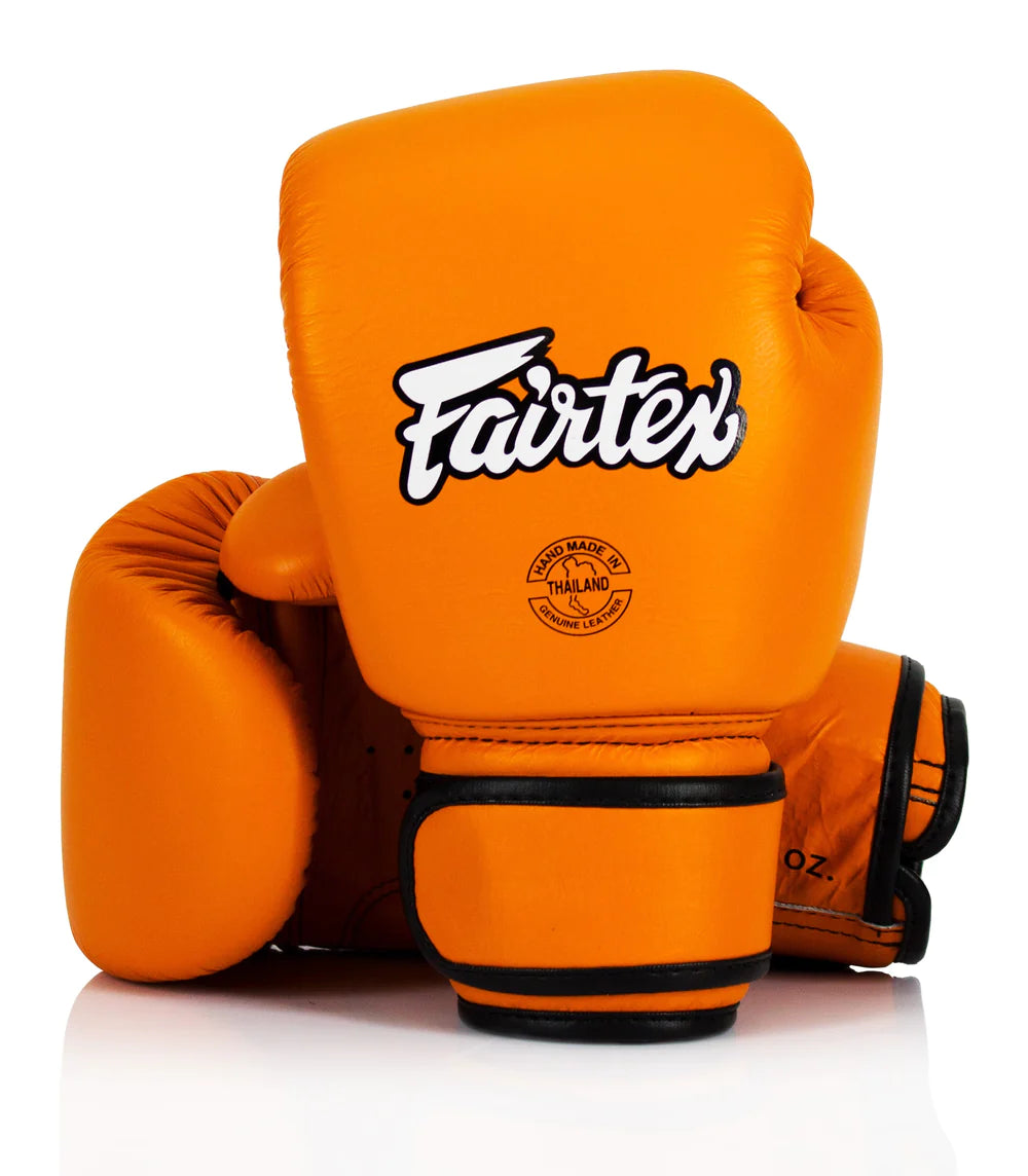 Orange Fairtex boxing gloves