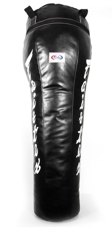 A black Fairtex Muay Thai heavy bag with white and red text detailing.