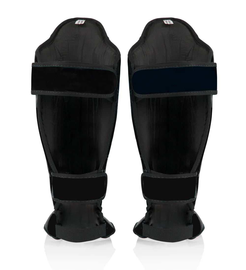 Back view of black Fairtex shin guards with hook-and-loop straps