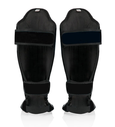 Back view of black Fairtex shin guards with hook-and-loop straps