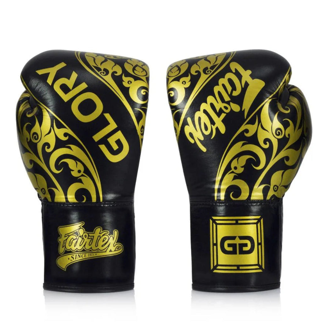 Pair of black and gold boxing gloves with 'Glorory' branding on a white background