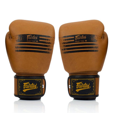 Pair of brown boxing gloves with Fairtex branding on a white background