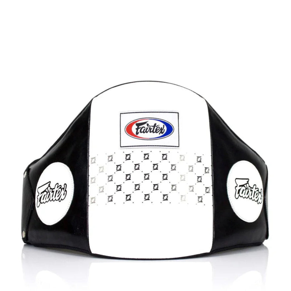 Black and white Fairtex boxing headgear on a white background