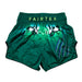Green Fairtex boxing shorts with a white design on a white background