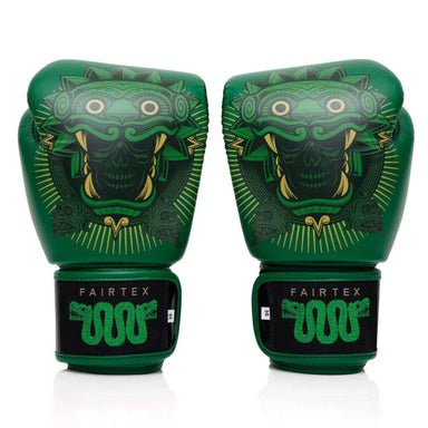 Pair of green boxing gloves with a fierce face design on a white background, featuring the Fairtex brand.