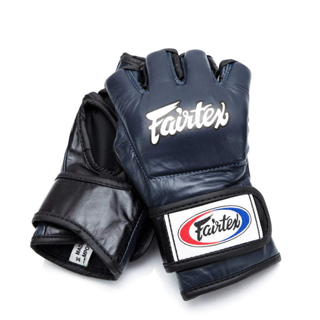 Pair of black Fairtex gloves on a white background