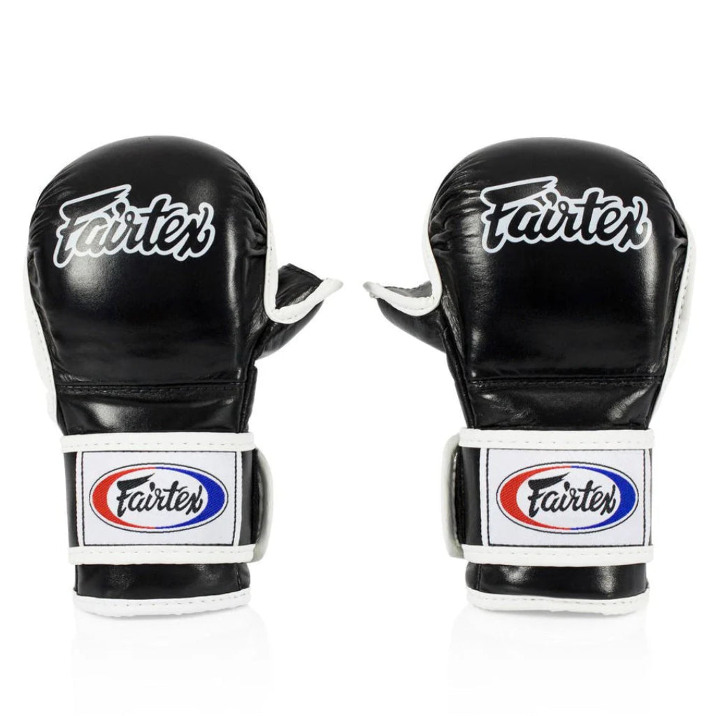 Pair of black Fairtex boxing gloves on a white background