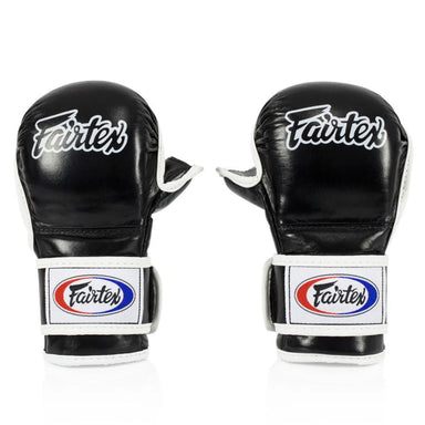 Pair of black Fairtex boxing gloves on a white background