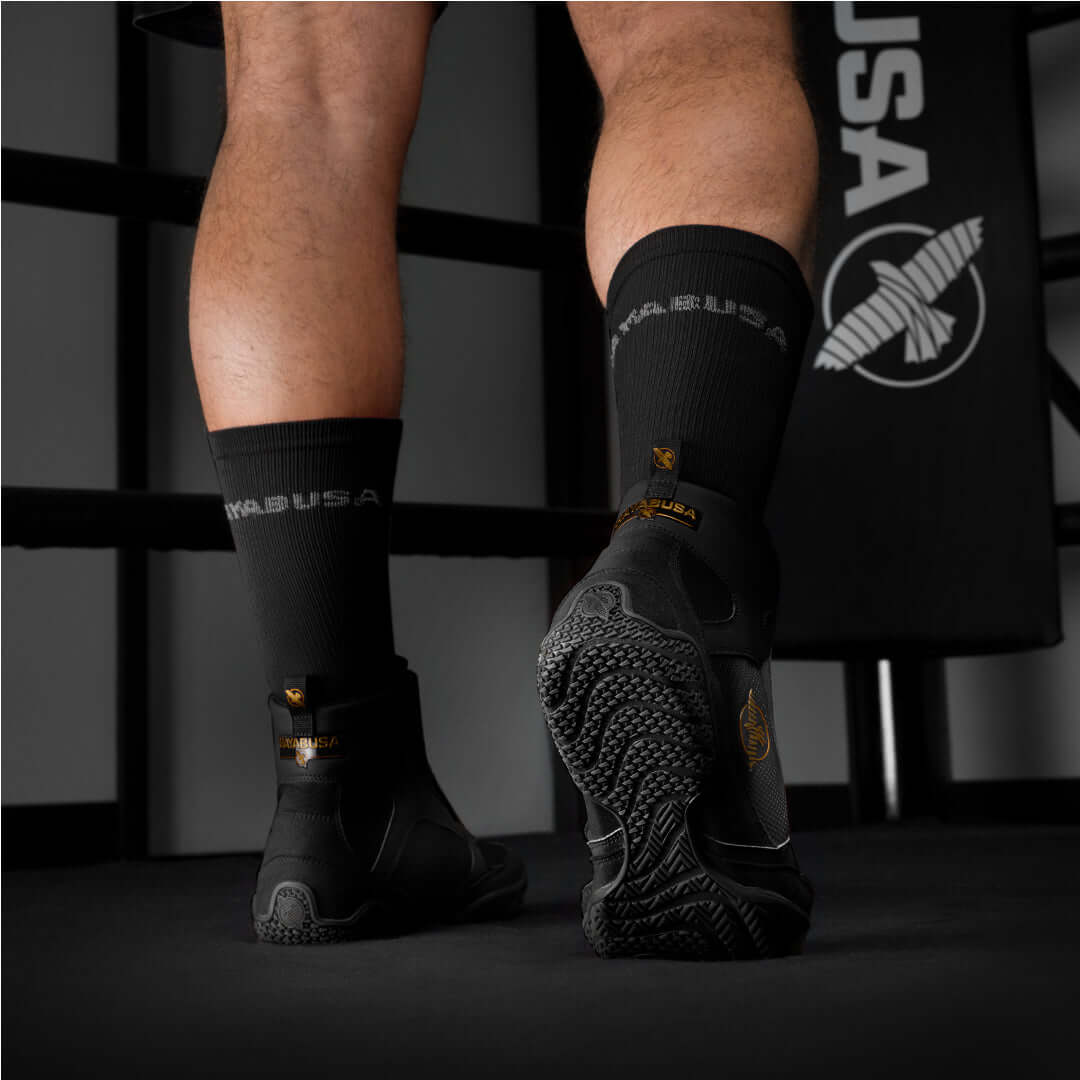 Boxer wearing black Hayabusa socks and boxing shoes