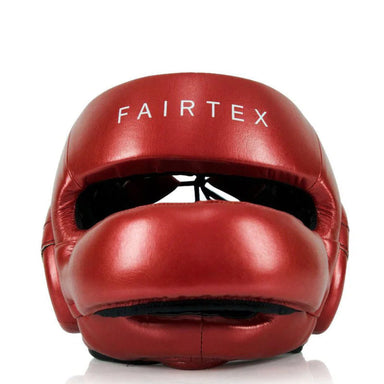 Red Fairtex boxing headgear on a white background